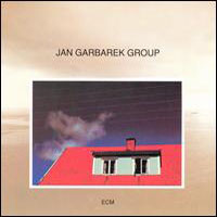 Jan Garbarek -  Photo with Blue Sky, White Cloud, Wires, Windows and a Red Roof
